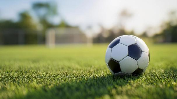 サッカーボールとグラウンド サッカーボールとグラウンドの写真