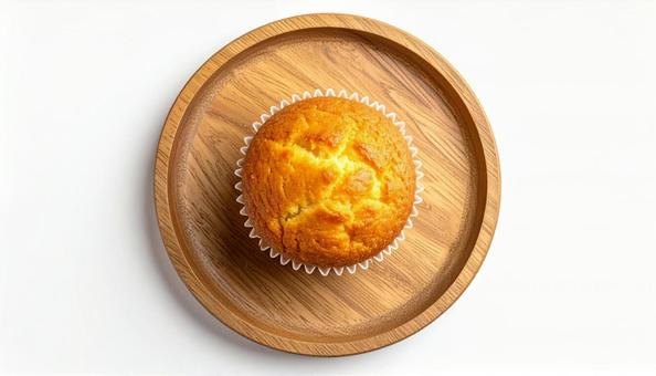 木製プレートに置かれたマフィン 木製プレートに置かれたマフィンの写真