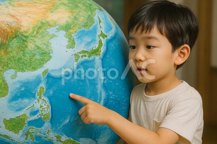  地球儀を指差す子ども  日本列島,日本,地図の写真素材