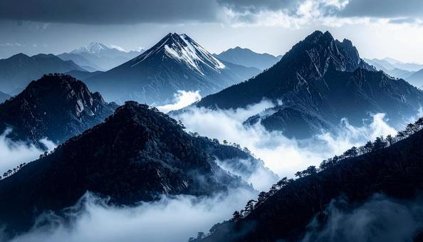 青い山並みと漂う霧の絶景 青い山並みと漂う霧の絶景の写真