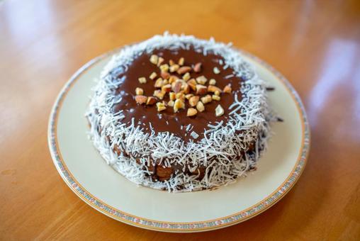 ナッツとココナッツのチョコケーキ ケーキ,チョコレートケーキ,ココナッツの写真素材