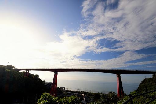 Yoneyama Bridge and the expansive sea bathed in the setting sun, JPG