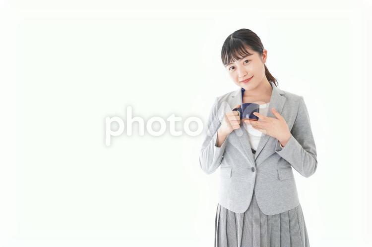 笑顔でコーヒーを飲む若いビジネスウーマン コーヒー,ブラックコーヒー,カップの写真素材