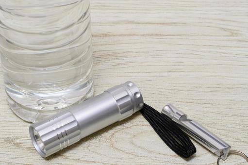 水と懐中電灯と笛で防災のイメージ 防災グッズ,防災,水の写真素材