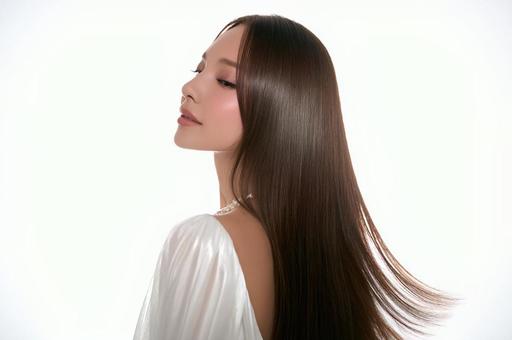 風で髪がなびく　日本人女性　白背景の写真