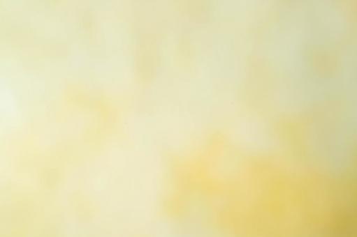 黄色の淡いぼかし背景の写真