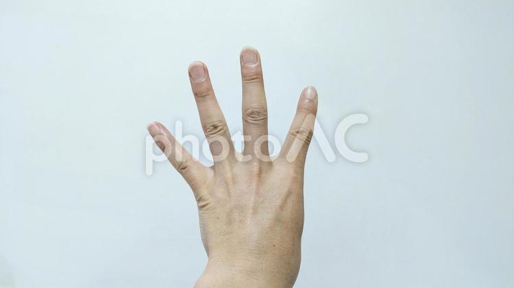 左手で四のサインをしている手素材 四のサイン,人差し指,中指の写真素材