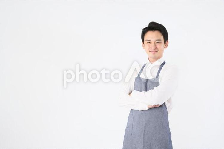 エプロンをつけた男性 飲食店,スタッフ,店員の写真素材