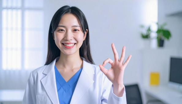 OKサインをする女性 OKサインをする女性の写真