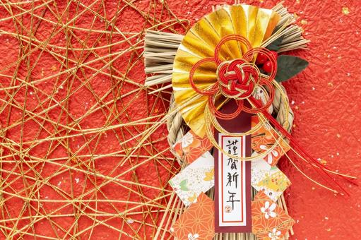 赤色背景の謹賀新年のしめ飾り 謹賀新年,しめ飾り,和紙の写真素材