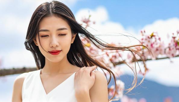 髪をなびかせる女性 髪をなびかせる女性の写真
