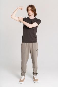 力こぶを触る長髪の男性 力こぶを触る長髪の男性 男性,力こぶ,触るの写真素材