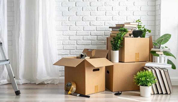 引っ越しの荷造りの段ボールの写真