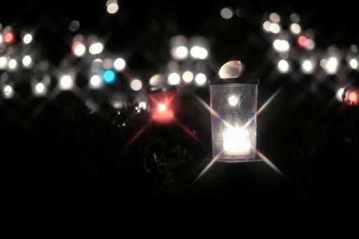 玉ボケを背景に輝くキャンドルの灯り キャンドル,キャンドルナイト,ろうそくの写真素材