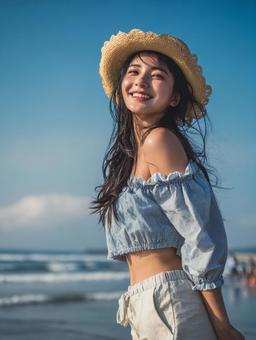 海辺の麦わら帽子を被った女性 海辺の麦わら帽子を被った女性の写真