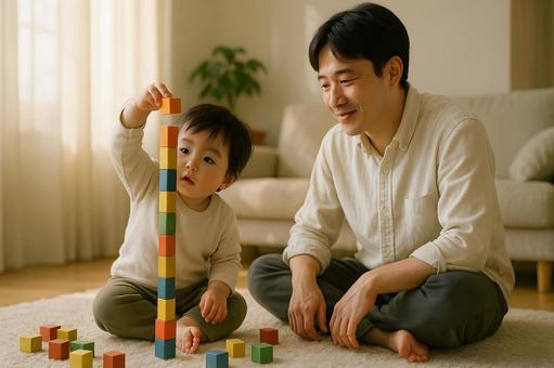 積み木で遊ぶ父と幼児の写真