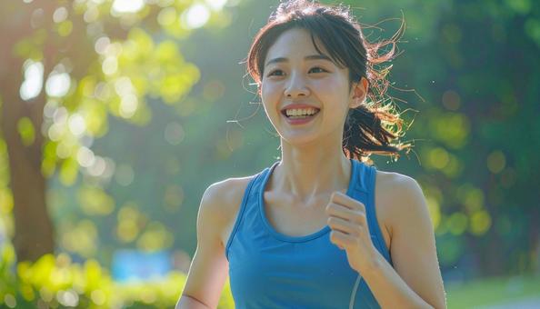 ジョギングする女性 ジョギングする女性の写真
