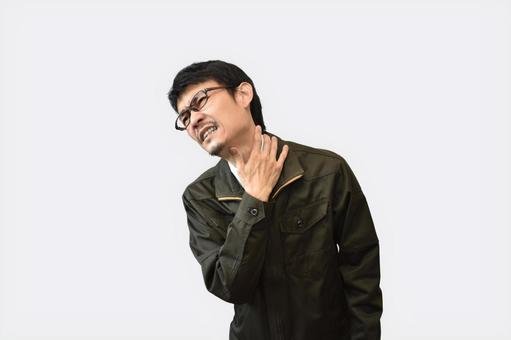 首筋を押さえる男性 首筋を押さえる男性の写真