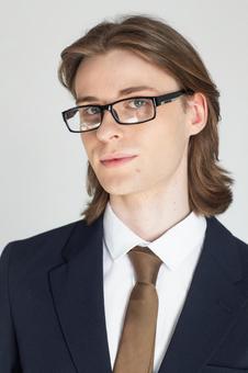 カメラ目線のスーツにメガネをかけた男性 男性,外国人,欧米人の写真素材