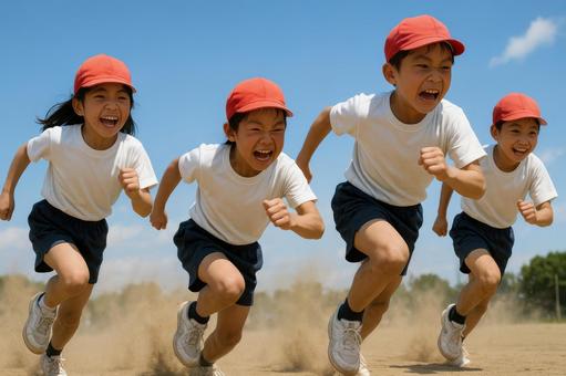 砂ぼこりを上げて走る小学生たち 砂ぼこりを上げて走る小学生たちの写真