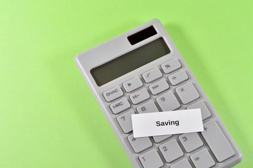 savingと電卓で節約のイメージ savingと電卓で節約のイメージ saving,節約,家計の写真素材