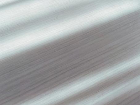 白いデスクに映るレース越しの朝陽の光３ 朝陽,朝,光の写真素材