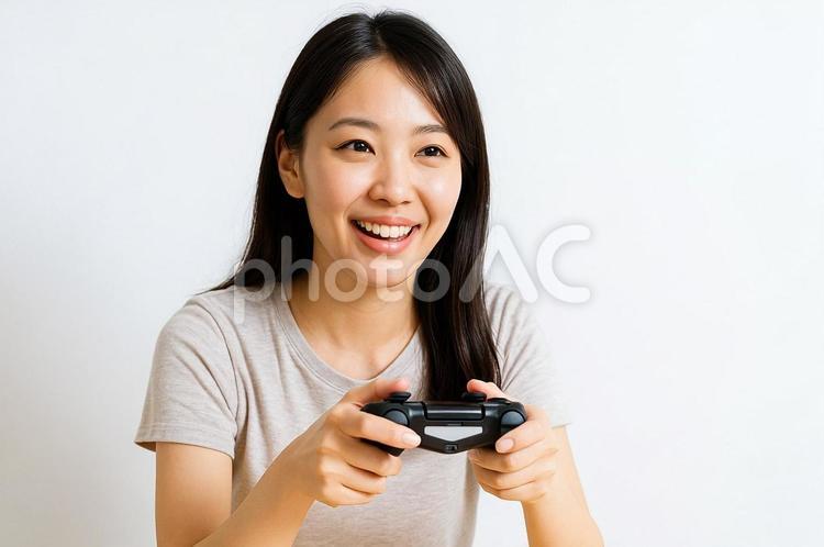 ゲームを楽しむゲーマー女性の笑顔・趣味 ゲーム,女性,ゲーマーの写真素材