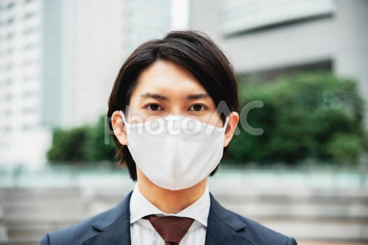 マスクをするビジネスマン マスク,ビジネスマン,ビジネスの写真素材