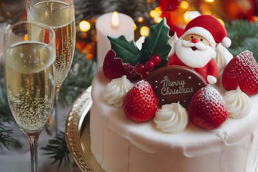 クリスマスケーキとシャンパンの写真
