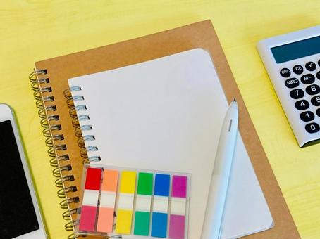 Two ring notebooks, sticky notes, a smartphone, and a calculator, JPG