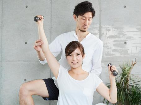 Japanese woman receiving dumbbell training from a personal trainer, mujer, guía, pesa, JPG