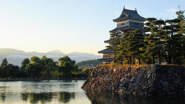 日が沈む初秋の松本城公園 松本城,夕景,大天守の写真素材