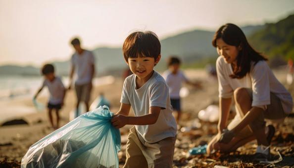 ボランティアで海辺のごみ拾いをする親子 ボランティアで海辺のごみ拾いをする親子の写真