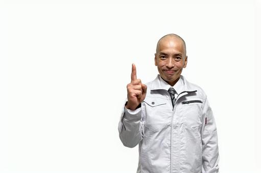 人差し指でオススメする作業着の中年男性 人差し指でオススメする作業着の中年男性 作業着,作業服,作業員の写真素材