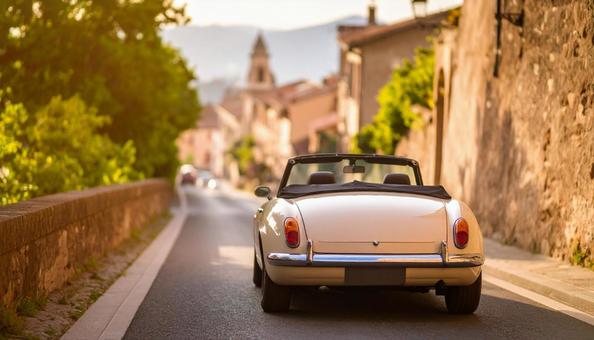 古い町並みの街角に止められたオープンカー 古い町並みの街角に止められたオープンカーの写真