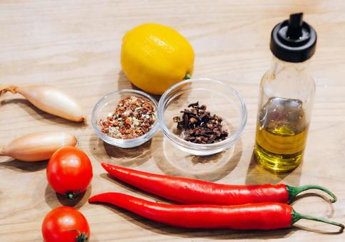Olive oil, spices and vegetables on the table, JPG