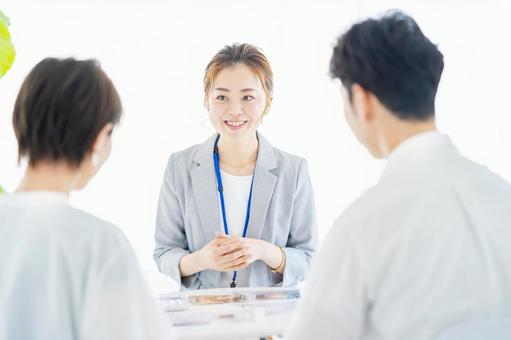 A woman in a suit who sells real estate to a couple, sales, business woman, consultation, JPG