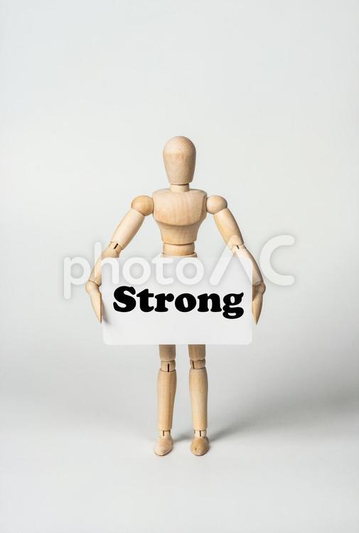 Strongのカードを持ったデッサン人形 strong,長所,meritの写真素材