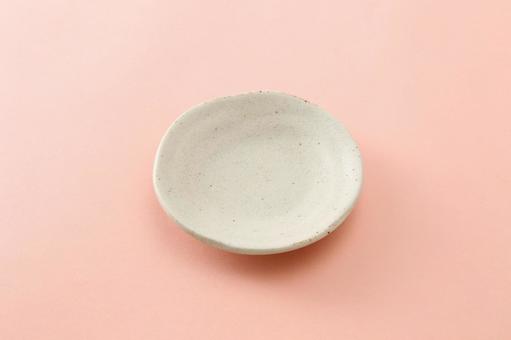 小皿_オレンジ背景の写真