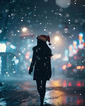 クリスマス サンタ帽子 女性 雪 夜 クリスマス サンタ帽子 女性 雪 夜の写真