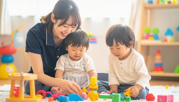 笑顔の保育士と遊ぶ子どもたち 笑顔の保育士と遊ぶ子どもたちの写真