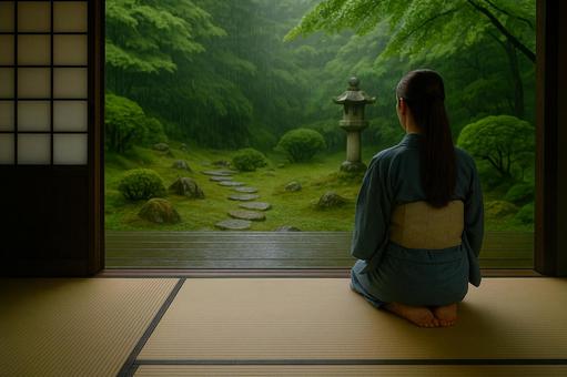 雨の庭を見つめる浴衣の女性 雨の庭を見つめる浴衣の女性の写真