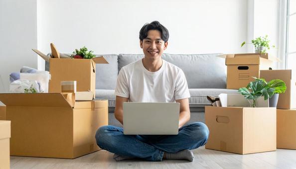 引越しをする若い日本人男性 引越しをする若い日本人男性の写真