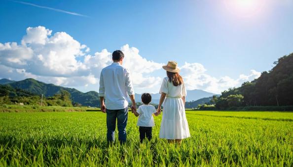 青空と草原の家族（ファミリー）赤ちゃんの写真