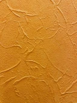 凹凸のあるオレンジ色の壁 壁,凹凸,デコボコの写真素材