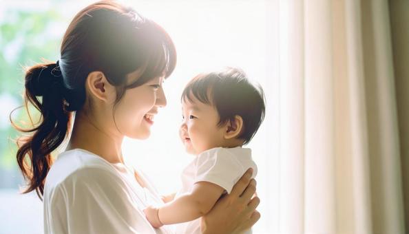 見つめ合う母親と赤ちゃん 見つめ合う母親と赤ちゃんの写真