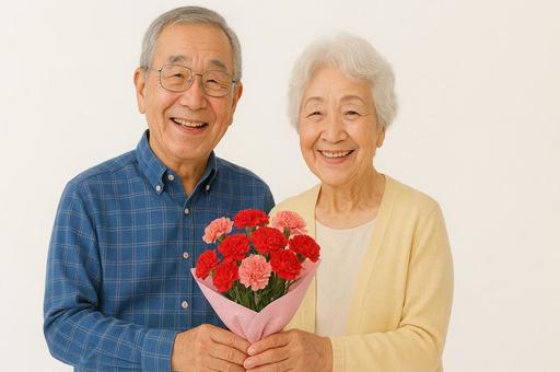 暖かな笑顔とカーネーションの花束 暖かな笑顔とカーネーションの花束の写真