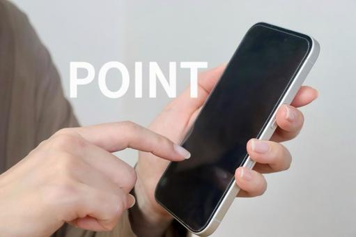 スマホを持つ女性 POINTイメージ スマホを持つ女性 POINTイメージ ポイント,point,スマホの写真素材