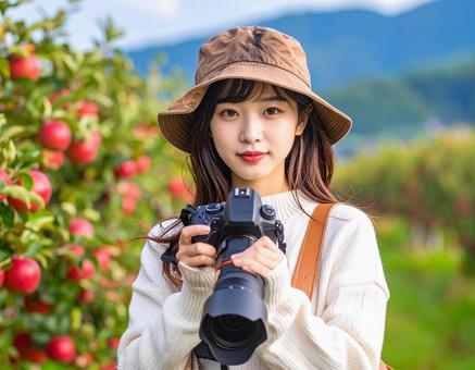 リンゴ畑・旅するカメラ女子 リンゴ畑・旅するカメラ女子の写真