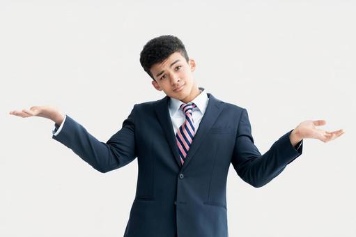 肩をすくめる若い外国人ビジネスマン 肩をすくめる若い外国人ビジネスマン 男性,ビジネスマン,ビジネスの写真素材